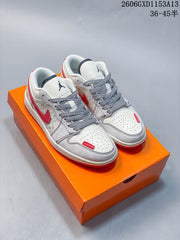 Jordan 1 Low White and Red Patterned Sneakers
