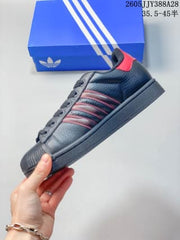 adidas Originals Superstar 2 Sneakers in Black and Red