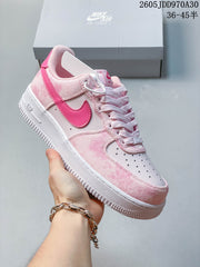 Nike Air Force 1 ’07 Low Sneakers in Pink or Mint