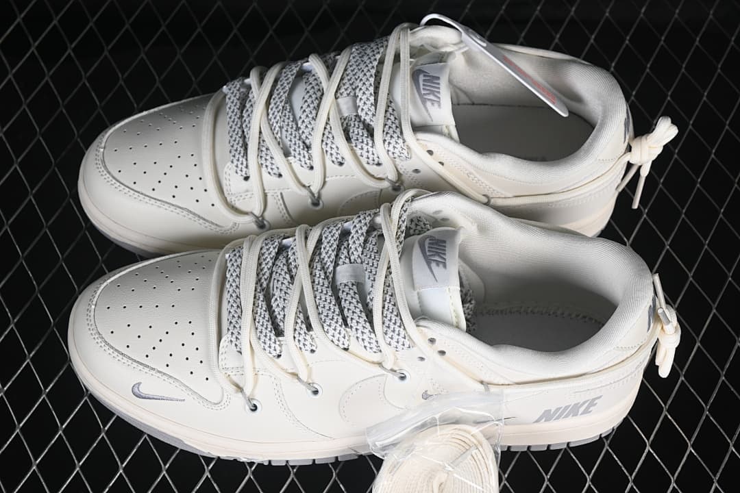 Nike SB Dunk Low Sneakers in Cream and Gray with Lace Details