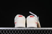 Nike SB Dunk Low Pro Supreme Sneakers in Cream and Red