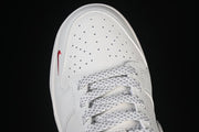Nike SB Dunk Low Pro Supreme Sneakers in Cream and Red