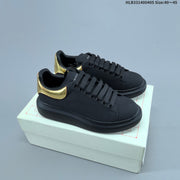Alexander McQueen Oversized Low-Top Sneakers, Black and Gold, HLB331400405