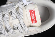 Nike SB Dunk Low Pro Supreme Sneakers in Cream and Red