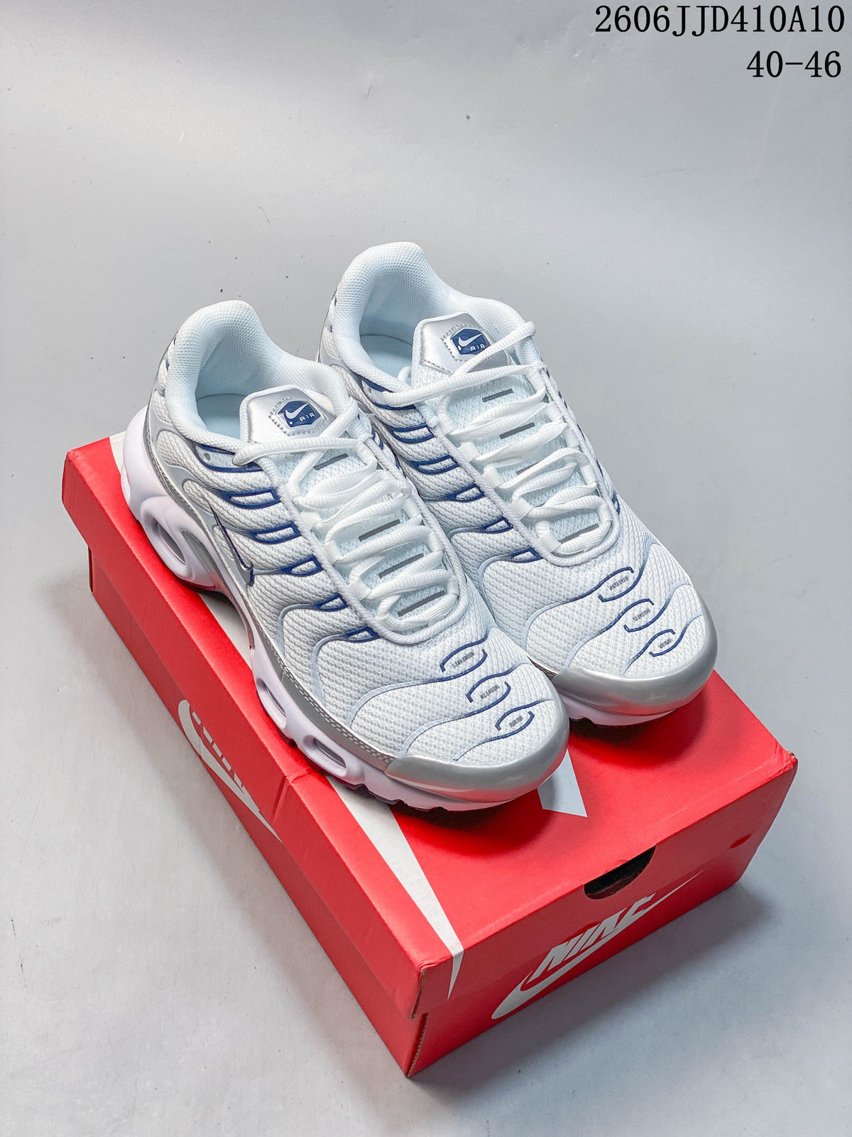 Nike Air Max 95 Sneakers in White/Blue and Gray/Orange