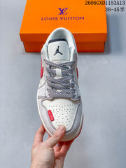 Jordan 1 Low White and Red Patterned Sneakers