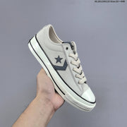 Converse Star Player Ox Low-Top Sneakers in Navy/White