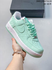 Nike Air Force 1 ’07 Low Sneakers in Pink or Mint