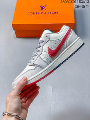 Jordan 1 Low White and Red Patterned Sneakers