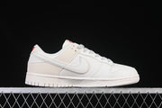 Nike SB Dunk Low Pro Supreme Sneakers in Cream and Red