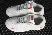 Nike SB Dunk Low Pro Supreme Sneakers in Cream and Red