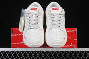 Nike SB Dunk Low Pro Supreme Sneakers in Cream and Red