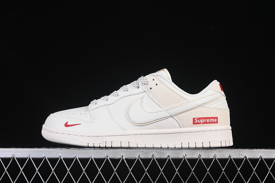 Nike SB Dunk Low Pro Supreme Sneakers in Cream and Red